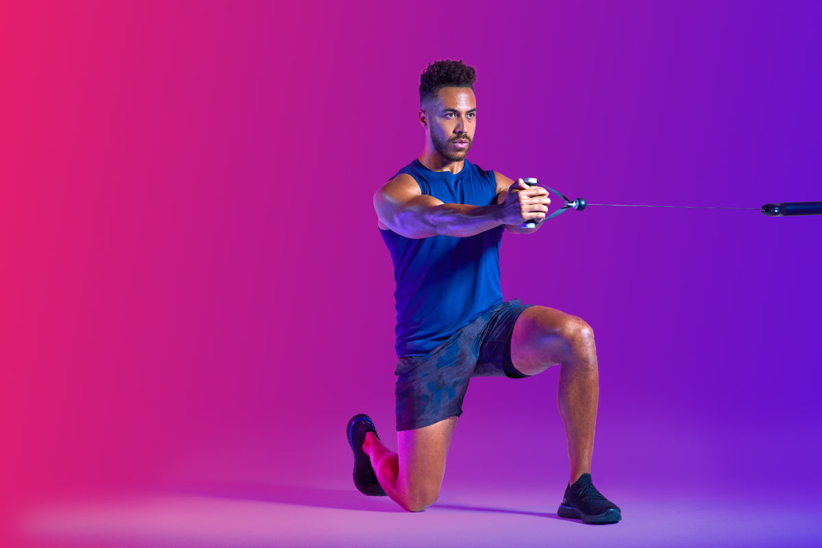 a man doing a half-kneeling pallof press