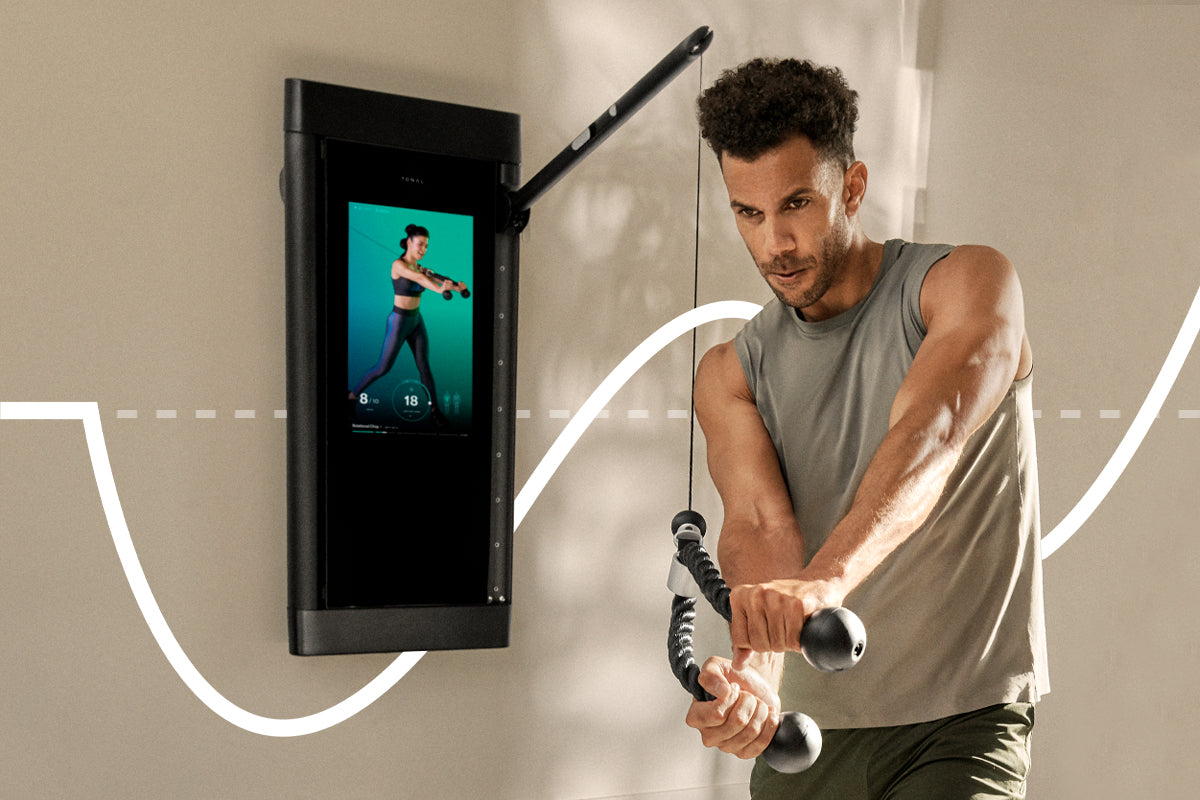 Man performing core exercise on Tonal with deloading and supercompensation graph behind him.