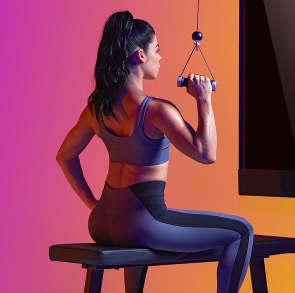 Person working out with a Tonal Resistance trainer