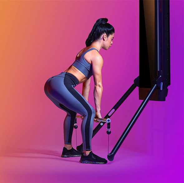 Person working out with a Tonal Resistance trainer