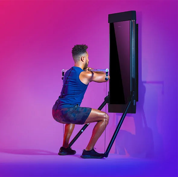 Person working out with a Tonal Resistance trainer