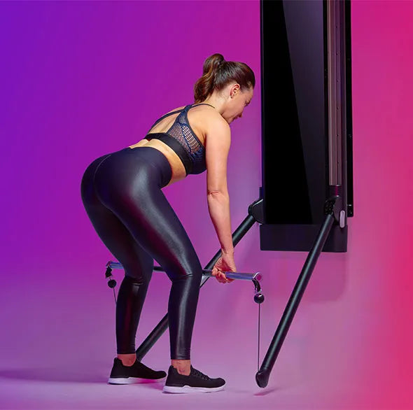 Person working out with a Tonal Resistance trainer