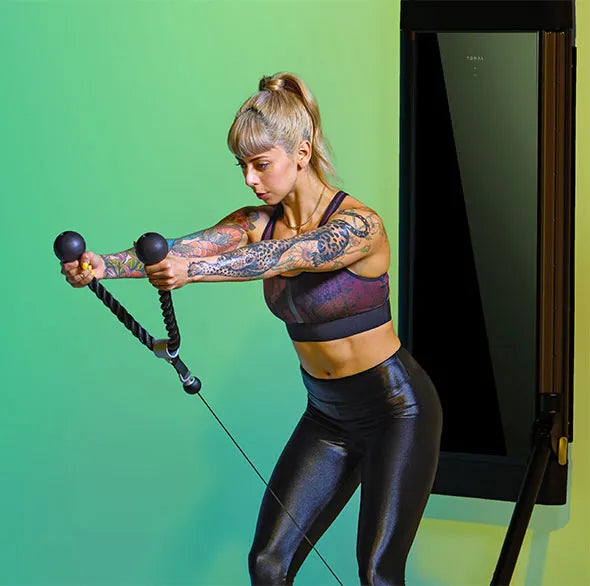 Person working out with a Tonal Resistance trainer