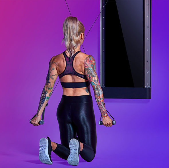 Person working out with a Tonal Resistance trainer