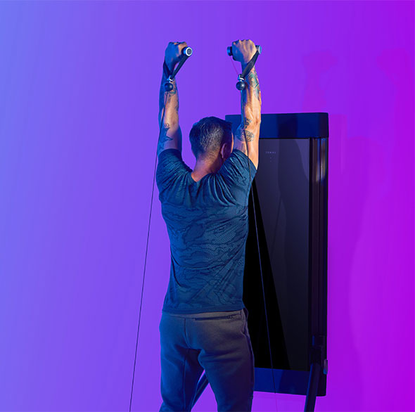 Person working out with a Tonal Resistance trainer