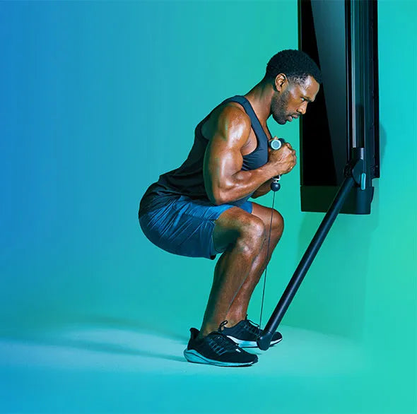Person working out with a Tonal Resistance trainer