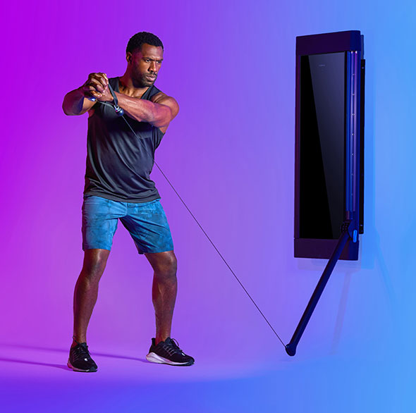 Person working out with a Tonal Resistance trainer