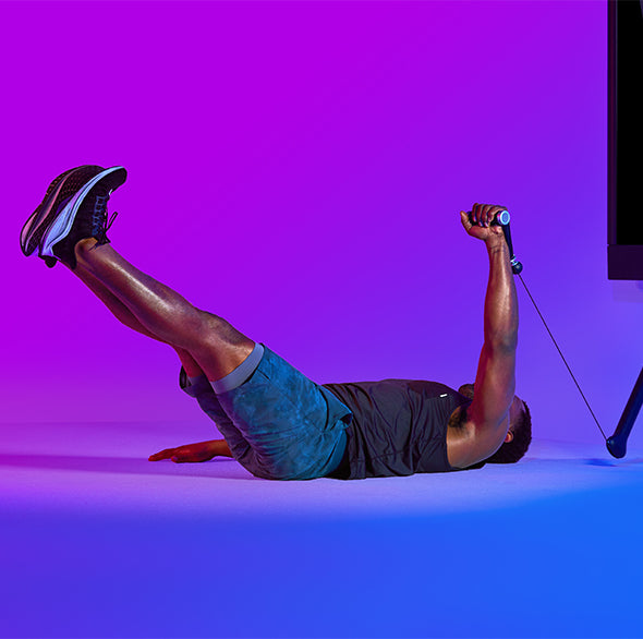 Person working out with a Tonal Resistance trainer