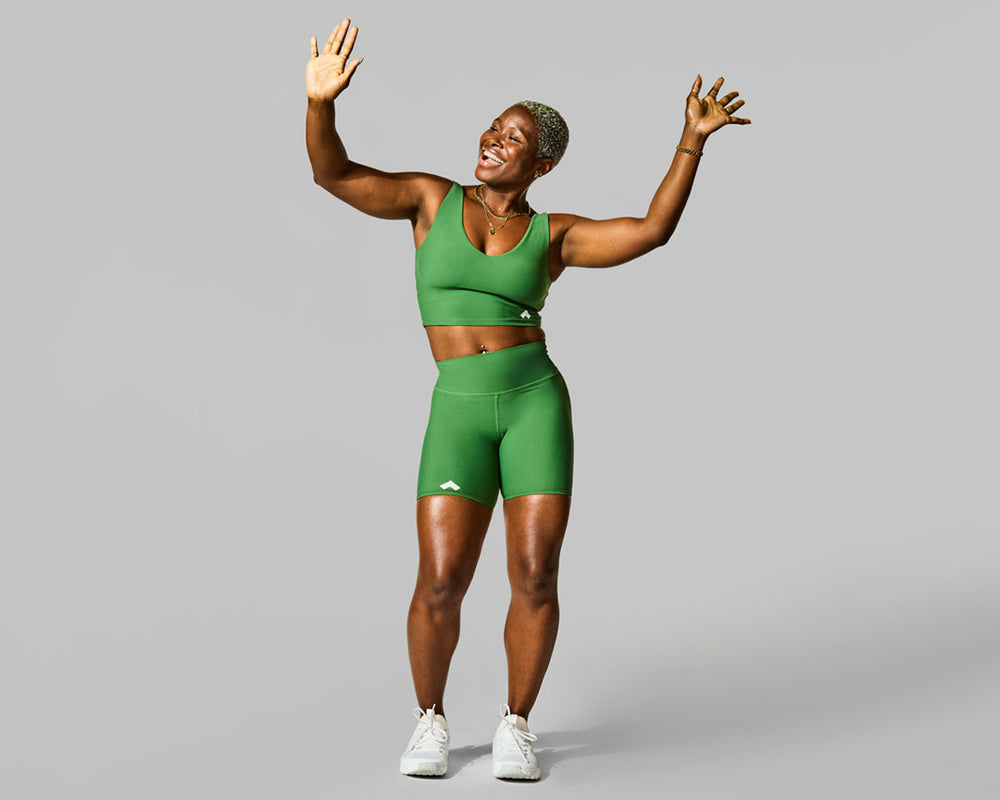 Woman doing Tonal on-the-go dance workout
