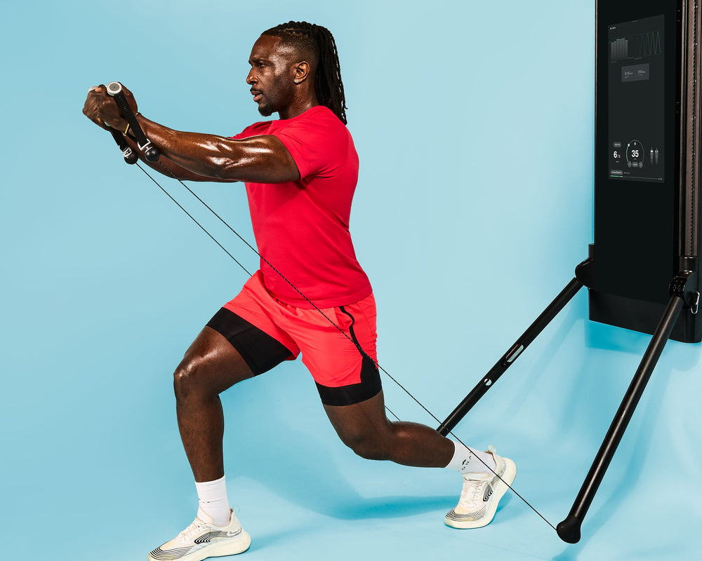 Tonal Coach Ackeem Emmons performing an incline chest fly.