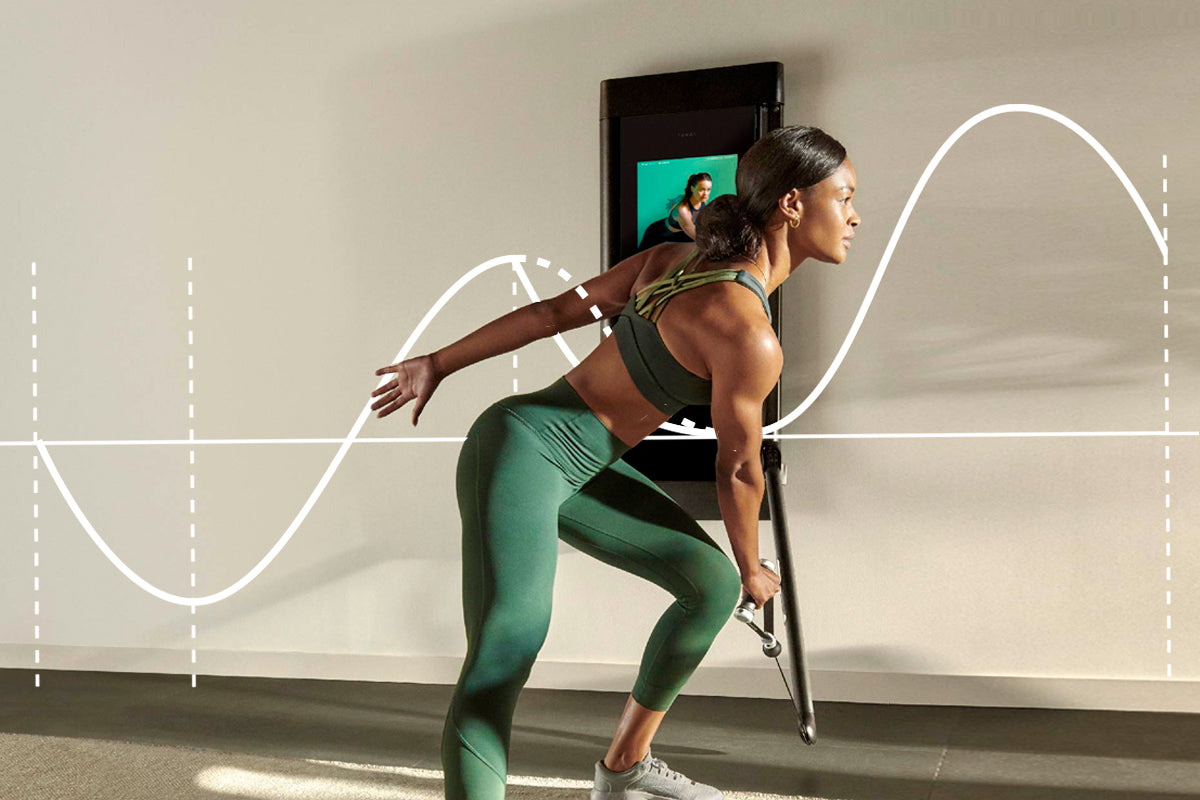 Image of a woman working out on Tonal to highlight story about stress adaptation.