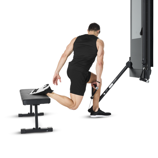 Person performing a Bulgarian Split Squat using a Tonal machine