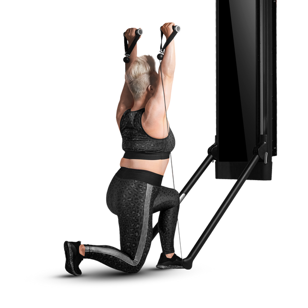 Kneeling overhead press using Tonal machine