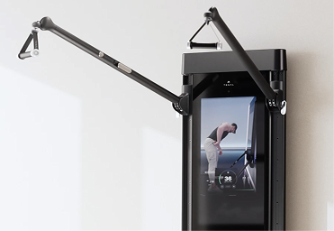 Tonal machine with arms extended ready for a workout