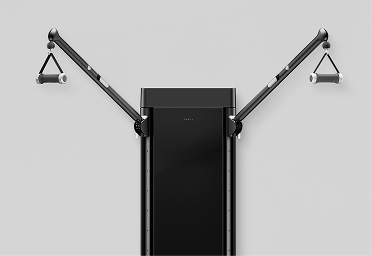 Tonal machine mounted on a wall with arms extended ready for a workout