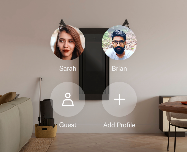 Tonal strength training system with user profiles displayed on a wall, including 'Sarah', 'Brian', and 'Guest'.