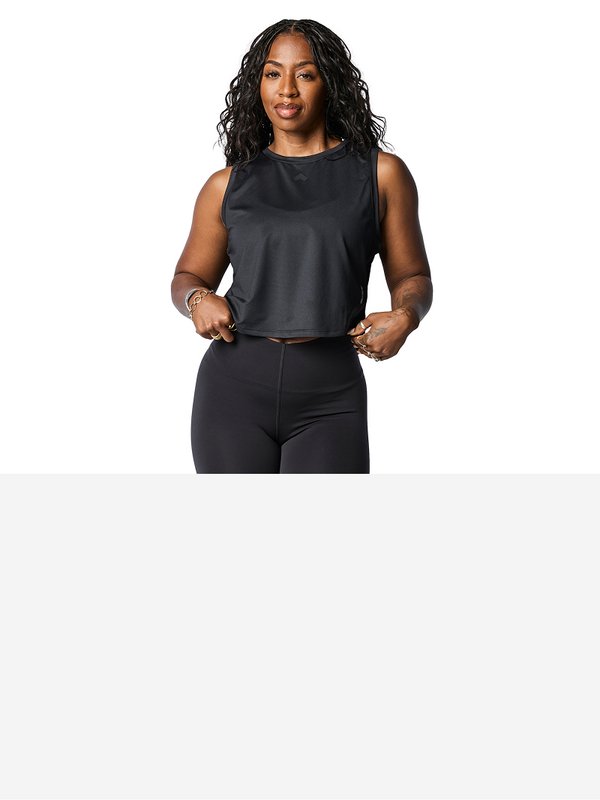 Woman wearing black Tonal Performance sleeveless tank