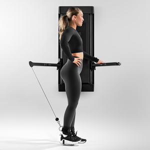 Woman using Tonal ankle straps in her workout