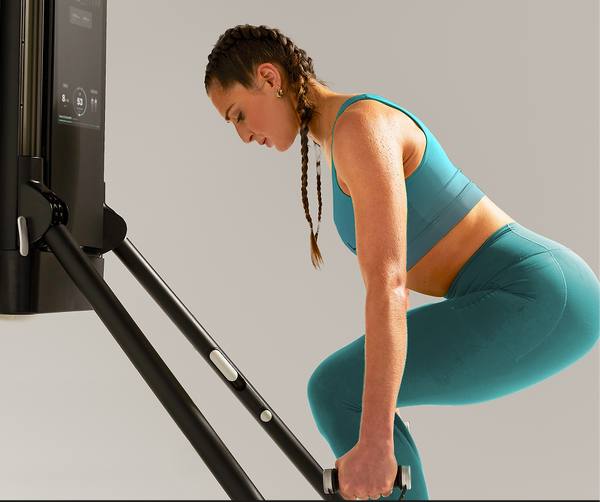 Woman bending down doing racked offset squat
