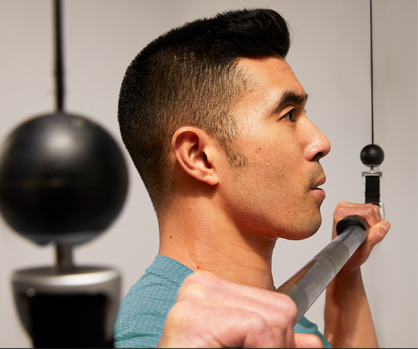Man doing barbell pulldown
